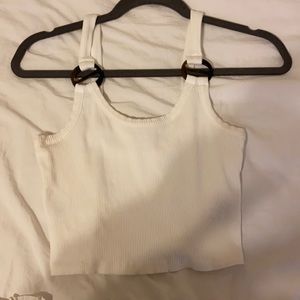 white tank with tortoise ring detail